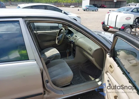 2000 Toyota Corolla Ce z USA, uszkodzony, nr VIN 1NXBR12E8YZ407349